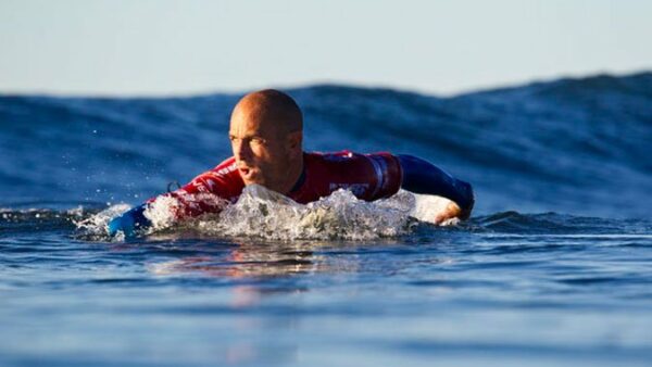 Kelly Slater paddling at Trestles in California