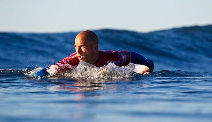 Kelly Slater paddling at Trestles in California