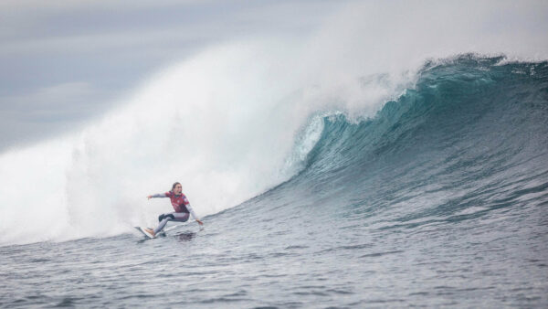 Nikki van Dijk riding a big surfboard in big waves